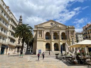 a group of people walking in front of a building at Studio Vieille Ville Toulon in Toulon