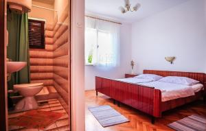 Postel nebo postele na pokoji v ubytování Apartments Biserka