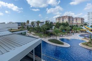 a view of a resort with a water park at Cozy Stay Free Pool Spa & Gym Close to Beach&Mall in Lara