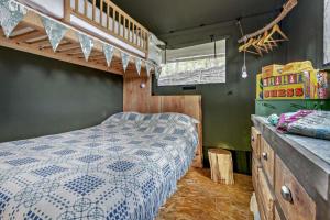 a bedroom with a bed and a loft bed at 2 Bed in Hay-on-Wye oc-h33385 in Hay-on-Wye