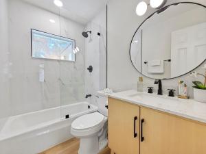 a bathroom with a sink toilet and a mirror at Vacation Villa in Tampa 17 Guest in Tampa +48 photos