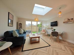 a living room with a blue couch and a table at 3 Bed in Shanklin oc-w33402 in Shanklin