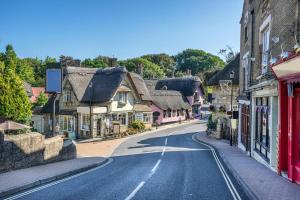 an empty street in a small town with houses at 3 Bed in Shanklin oc-w33402 in Shanklin +13 photos