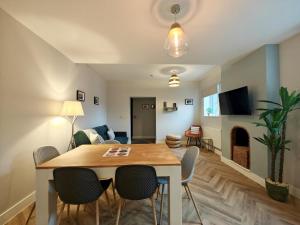 a dining room and living room with a table and chairs at 3 Bed in Shanklin oc-h33403 in Shanklin