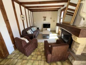 an overhead view of a living room with a fireplace at Villa de l Olivaie in Les Grenettes