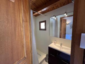 a bathroom with a sink and a mirror at Villa de l Olivaie in Les Grenettes +19 photos