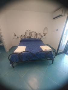 Ένα ή περισσότερα κρεβάτια σε δωμάτιο στο Stella Marina