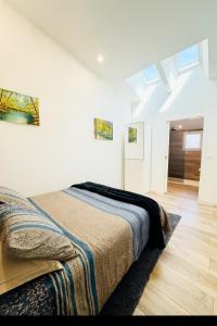 Postel nebo postele na pokoji v ubytování La Bulle Médocaine villa design avec jaccuzy privé