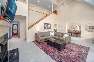 a living room with a couch and a fireplace at Lake Days Getaway in Hillsborough