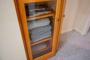 a wooden cabinet with towels in a room at Lake Days Getaway in Hillsborough +104 photos