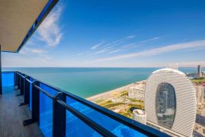 a view of the ocean from the balcony of a building at Exclusive Sea View Aparthotel In Orbi City Batumi in Batumi