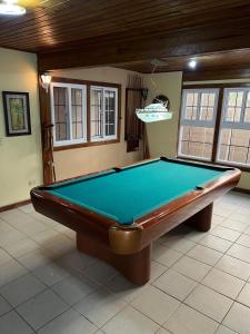 a pool table in the middle of a room at Beachfront Omoa Getaway, Pool, Pool Table For 10 in Omoa