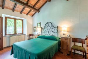 Ένα ή περισσότερα κρεβάτια σε δωμάτιο στο Agriturismo San Michele