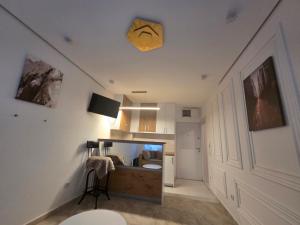 a living room with a sink in a room at Stan na dan Zvezdara in Belgrade