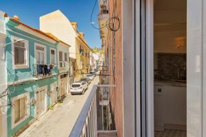 a view from a window of a street with buildings at GS Home in Setúbal in Setúbal