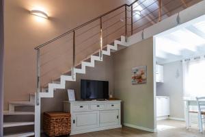 TV a/nebo společenská místnost v ubytování Appartamento in residence con piscina