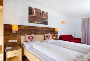 Rúm í herbergi á Hotel Gasthof Weiherbad