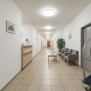 a corridor of a hospital with a waiting room at Hotel Liif Niine Butik, Near Leisure Valley Park, Golf Course Road in Gurgaon