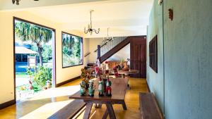 a room with a table with bottles on it at Pousada da Sirlei in Tiradentes