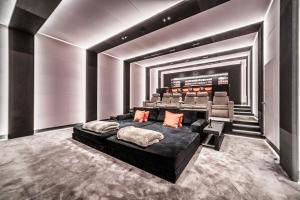 a bedroom with a black bed in a room at Chateau De Neydens in Saint-Cergues +33 photos