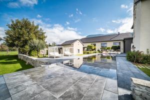 a swimming pool in the backyard of a house at Chateau De Neydens in Saint-Cergues