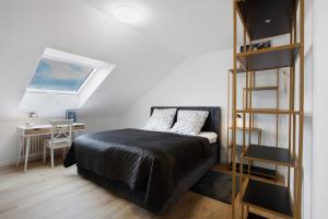 Кровать или кровати в номере Dreiländerblick Apartments Lörrach