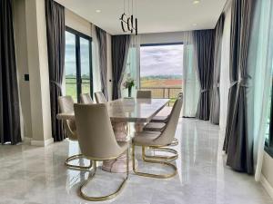 a dining room with a glass table and chairs at Cloud N Wind Khao Kho Thailand in Ban Lao Kok Kho +22 photos