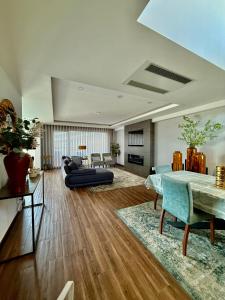 a living room with a couch and a table at Valadares House in Corroios