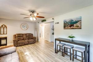 a living room with a couch and a table at Half-Mi to Dtwn Yankton and River Charming Home! in Yankton