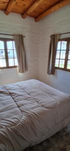 Postel nebo postele na pokoji v ubytování Brisas del Sur Chalet 2