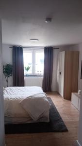 Ένα ή περισσότερα κρεβάτια σε δωμάτιο στο Apartment - Wohnung Bad Pyrmont