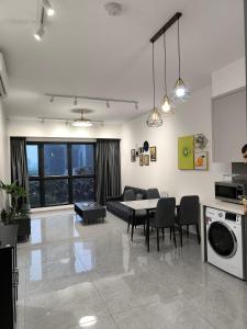 a living room with a couch and a table at Travel Malaysia At Agile Bukit Bintang KL in Kuala Lumpur