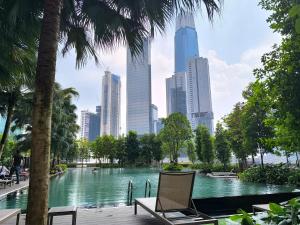 a pool in the middle of a city with tall buildings at Travel Malaysia At Agile Bukit Bintang KL in Kuala Lumpur