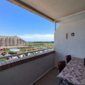 a balcony with a table and a view of a resort at Nasay Magic World in El Borseral