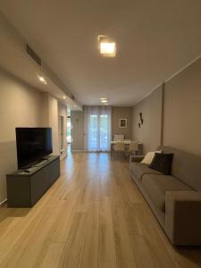 Et tv og/eller underholdning på PARCO VERDE APARTMENT + 29 billeder