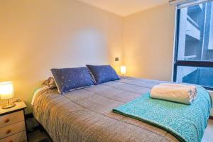 En eller flere senge i et værelse på HOM I Gimnasio Piscina Temperada Sauna