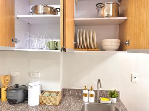 a kitchen with a sink and a counter top at 128A Condotel Near Airport in Lapu Lapu City