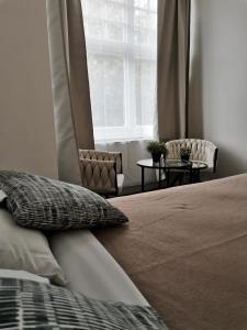 Ένα ή περισσότερα κρεβάτια σε δωμάτιο στο Chiswick Court Hotel +15 φωτογραφίες