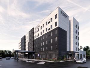 a rendering of the front of a hotel at Staybridge Suites Aurora East by IHG in Aurora