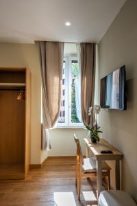 a living room with a table and a window at MAMA Luxury in Rome +26 photos