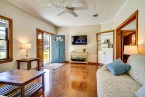 a living room with a couch and a table at Peaceful Patio, Sunroom Pet-Friendly Baldwin Home in Franklin