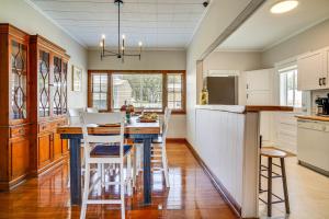 a kitchen with a table and some chairs in it at Peaceful Patio, Sunroom Pet-Friendly Baldwin Home in Franklin