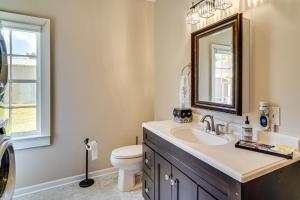 a bathroom with a sink and a toilet and a mirror at Peaceful Patio, Sunroom Pet-Friendly Baldwin Home in Franklin +19 photos