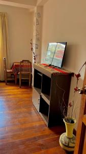 a desk with a laptop computer on top of it at Hotel Avenida in La Paz