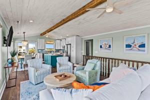 a living room with a couch and chairs and a table at Sunny Second Row Beach and BIG views in Varnamtown