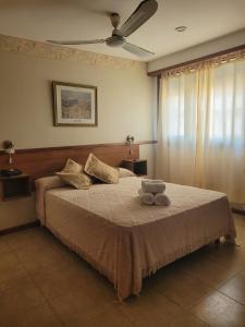 Ένα ή περισσότερα κρεβάτια σε δωμάτιο στο Apolo Hotel