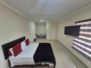 Ένα ή περισσότερα κρεβάτια σε δωμάτιο στο Ithonsi Guesthouse