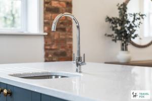 a kitchen sink with a faucet on a counter at The Old Chapel in Dilhorne +48 photos