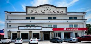 a building with a sign for a hotel la mansion at Hotel La Mansión in Río Bravo