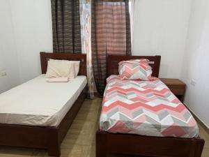 Ένα ή περισσότερα κρεβάτια σε δωμάτιο στο Cape Coast Private Home